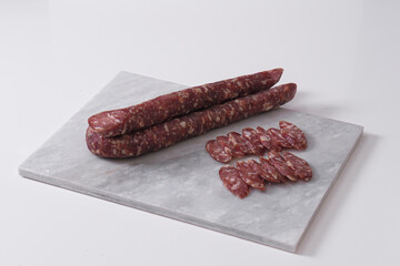 Homemade beef sausage on a light background