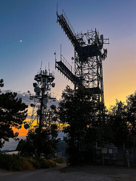Sunset over towers in the forest