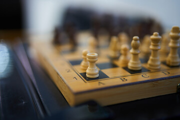 Chess pieces on board during a strategic match in a quiet room