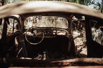 Old vintage car, broken, abandoned, alone, destroyed