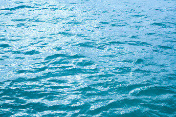 Ocean water waves with copy space. Water surface in swimming pool. Blue sea water background. Clear sea water texture. Sea ocean background.
