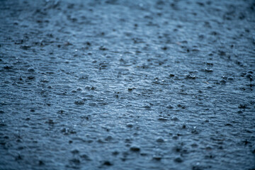 Water texture. Raindrops background. Rain. Falling raindrops. Water drop splash. Abstract shape out...