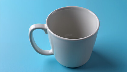 Obraz premium Empty White Mug on Blue Background, Minimalist Design