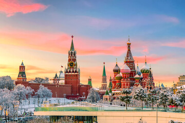 View of Kremlin and St. Basil Cathedral at the Red Square during sunset in winter. Famous landmarks in Moscow, Russia