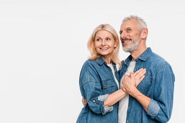 Cheerful smiling funny couple family elderly gray-haired man blonde woman in denim shirt casual...