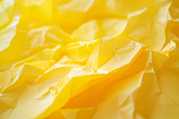 Vibrant yellow crumpled paper texture close-up showcases unique patterns
