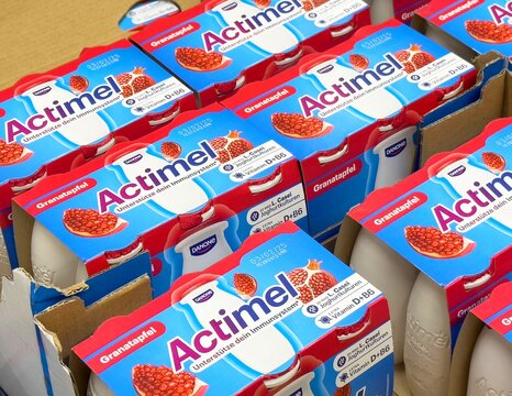 Pomegranate actimel cartons displayed in supermarket shelf