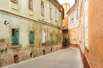 Romania, Brasov. 16th century arcaded, and terra cotta roofed houses and narrow streets.
