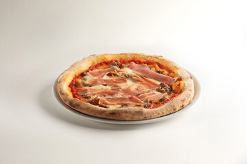 delicious pizza with raw ham, tomato sauce  and mozzarella on white background - san Daniele