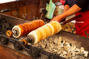 Romania, Transylvania, a Alba Iulia. Bread type donuts roasting over coals.