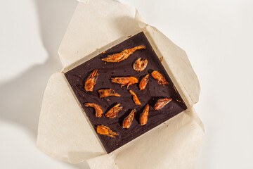 Unusual chocolate with dried shrimp. Craft chocolate