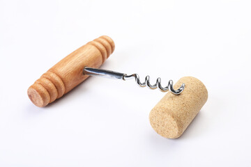 Corkscrew with wooden handle and cork on white background