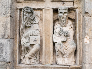 Sculptors or carvings of the 'doormen' on the Puerta Santa doorway of the Santiago Cathedral.