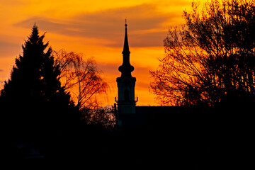 Church tower in Csongrad at sunset