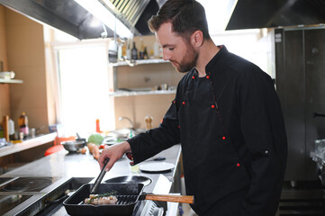 Smiling chef in his kitchen