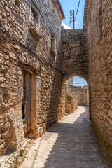 Obraz premium Montfalco murallat walled medieval village the Lerida province, Cataluña, Spain, in a sunny day.