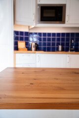 empty desk space and blurred kitchen background
