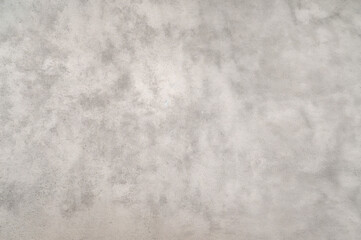 Fototapeta premium a gray concrete wall texture with minor imperfections.