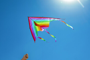 Man with colorful kite on sunny day, closeup
