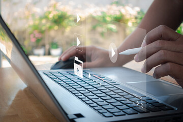 Video streaming on internet. Man hands using laptop computer for streaming and watching online...
