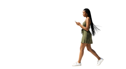 Businesswoman using phone during coffee break with paper cup in hand