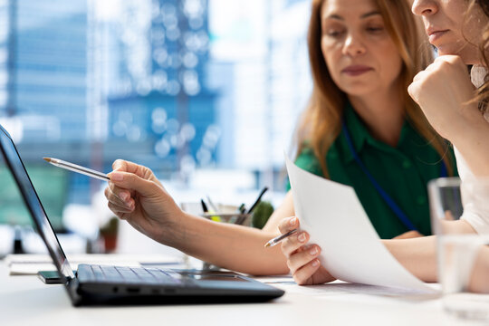 Employers using laptop device to find qualified candidates through job postings, using recruiting tools. Close up of HR coworkers identifying skilled employees to get hired for company position