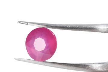 Tweezers with shiny pink gemstone isolated on white