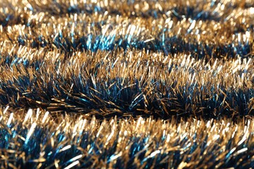 Beautiful shiny tinsel as background, closeup view