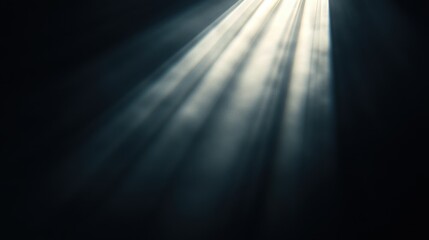 A serene, abstract background with beams of light streaming through darkness, creating a heavenly and ethereal atmosphere.