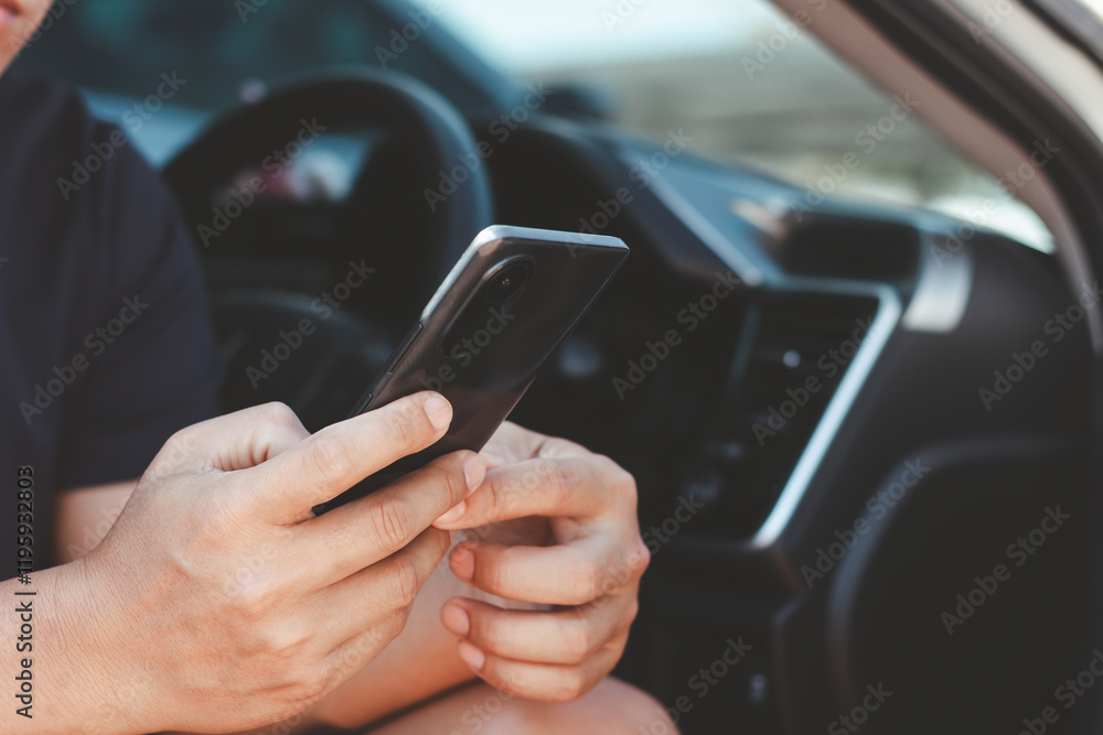 Poster a man hand holding a smartphone in his car. person use map on mobile phone app to search for route l