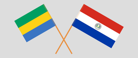 Crossed flags of Gabon and Republic of Paraguay. Official colors. Correct proportion. Vector illustration