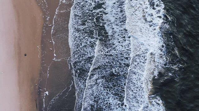 Waves at danish coastin aerial view
