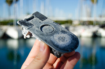 The old boat leverlock is damaged by the aggressive marine environment