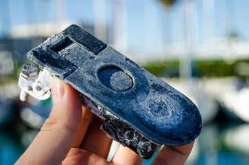 The old boat leverlock is damaged by the aggressive marine environment