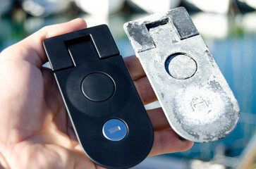 Two locks for the sailing yacht's lockers. One is old, and one is new as a replacement