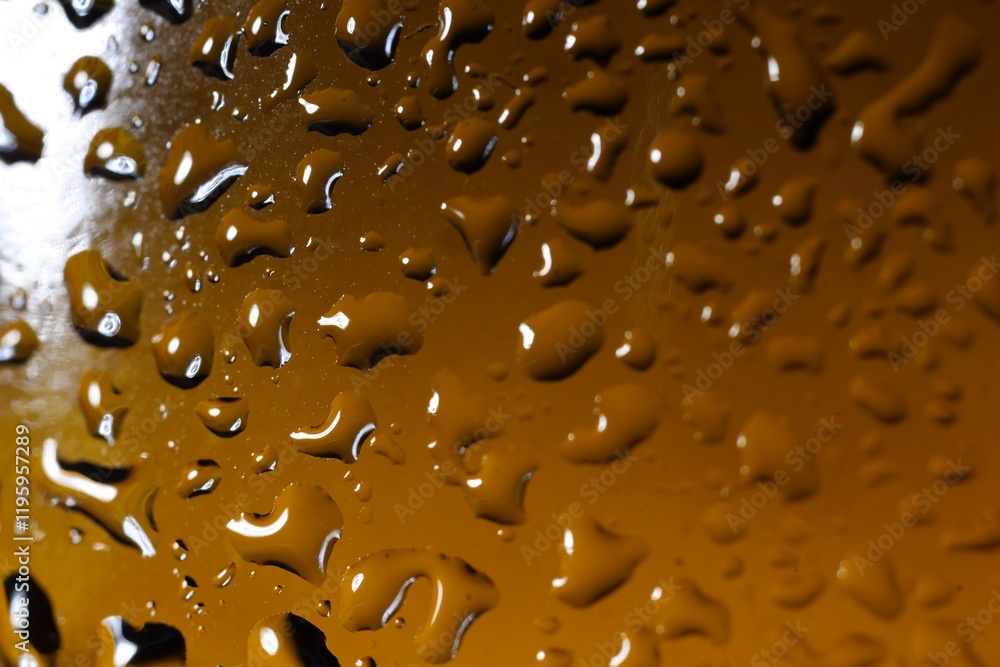 Wall mural Water drops on color glass surface, macro view