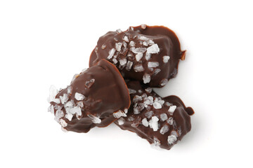 Tasty chocolate candies with salt isolated on white, top view