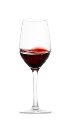 Red wine splashing in glass on white background