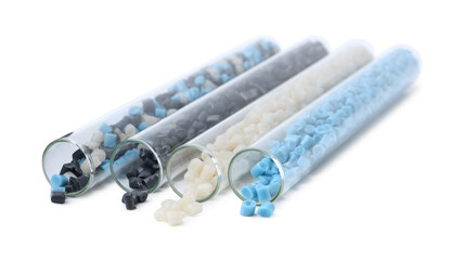 Colorful plastic granules in test tubes isolated on white
