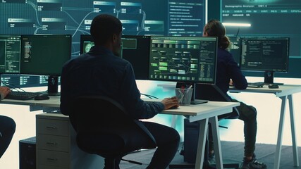 Cyber intelligence team of experts in a governmental hacking room, implementing ways to protect...