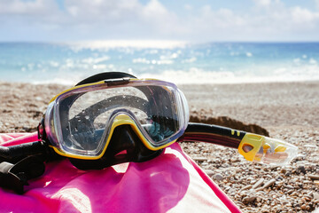 Snorkeling mask, snorkeling in the sea, mask and snorkel against the blue sea, activities on...