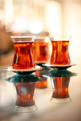 Traditional Turkish tea in tulip-shaped glasses, vacation in Turkey, gift from Turkey