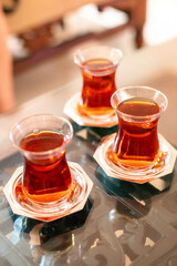 Traditional Turkish tea in tulip-shaped glasses, vacation in Turkey, gift from Turkey