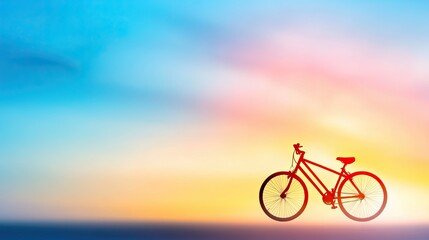 Obraz premium Classic Bicycle Silhouette Against a Soft Pastel Gradient Background Capturing a Serene Moment