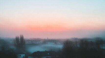 Blurred sunrise over quiet town with soft pastel sky