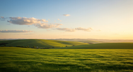 Serene Sunset Over Rolling Green Hills and Lush Meadow