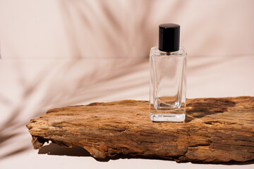 bottle of perfume on wooden background