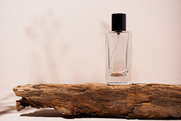 bottle of perfume on wooden background