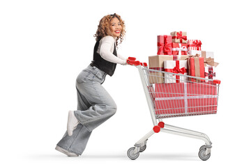 Asian woman running and pushing a shopping cart with presents