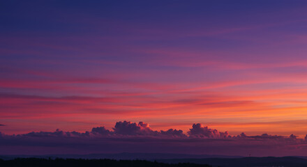 Vibrant Sunset Landscape with Pink and Orange Clouds